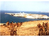View of the island off St Paul`s bay, Malta, with the monument at the traditional site of Paul`s landing.